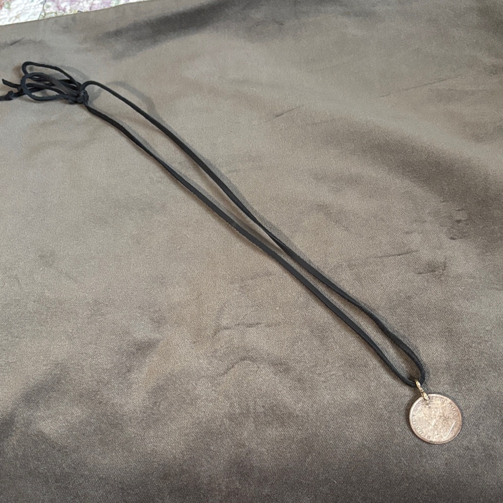 Round Textured Metallic Pendant on Black Cord